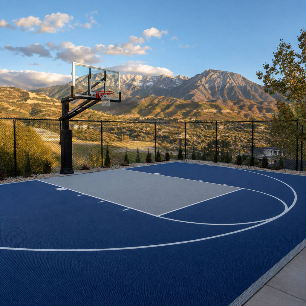 Completed concrete basketball court with sport coating and lines in Draper Utah backyard with Wasatch Mountain views