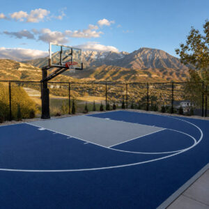Completed concrete basketball court with sport coating and lines in Draper Utah backyard with Wasatch Mountain views